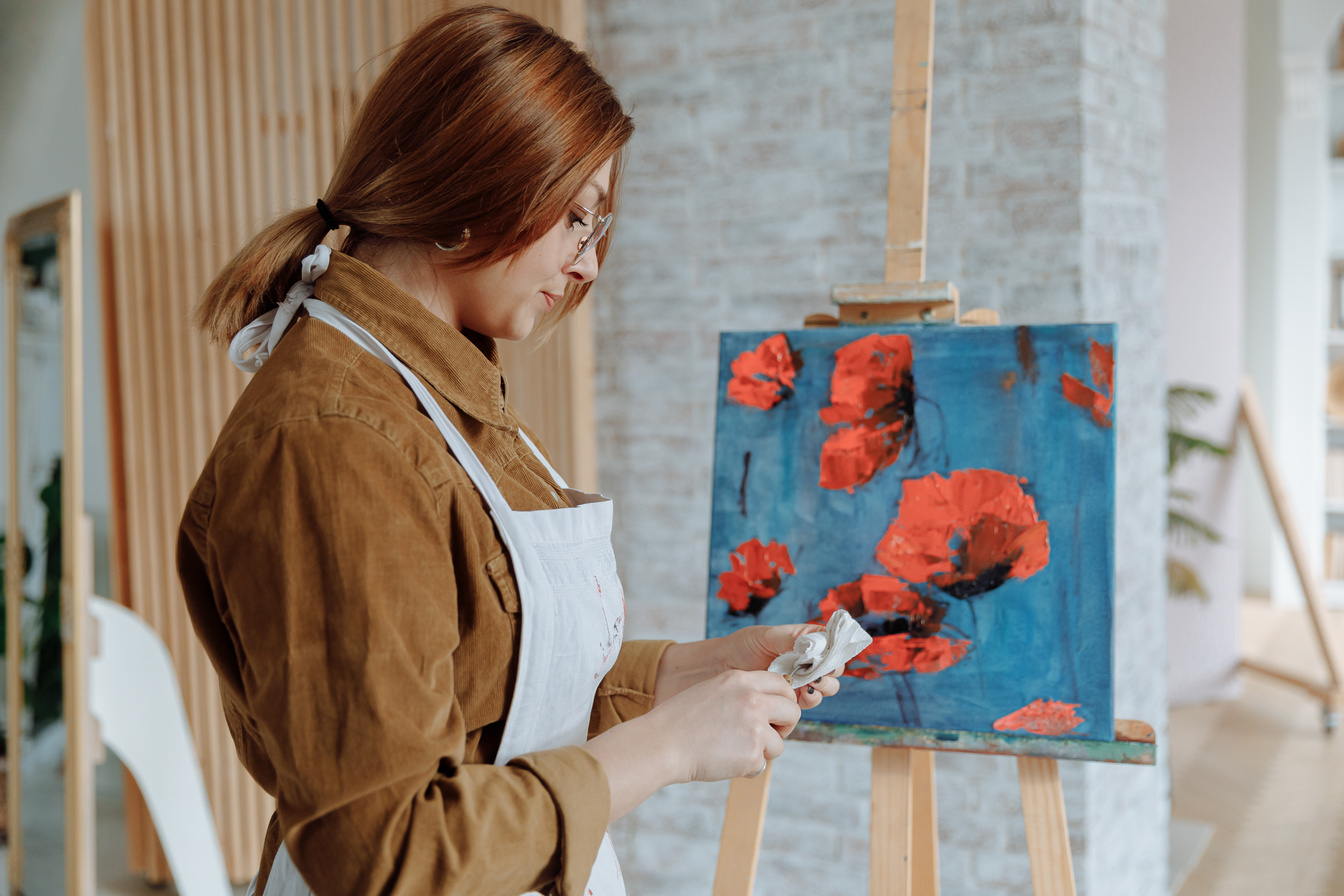 Woman cleaning a Painting Tool